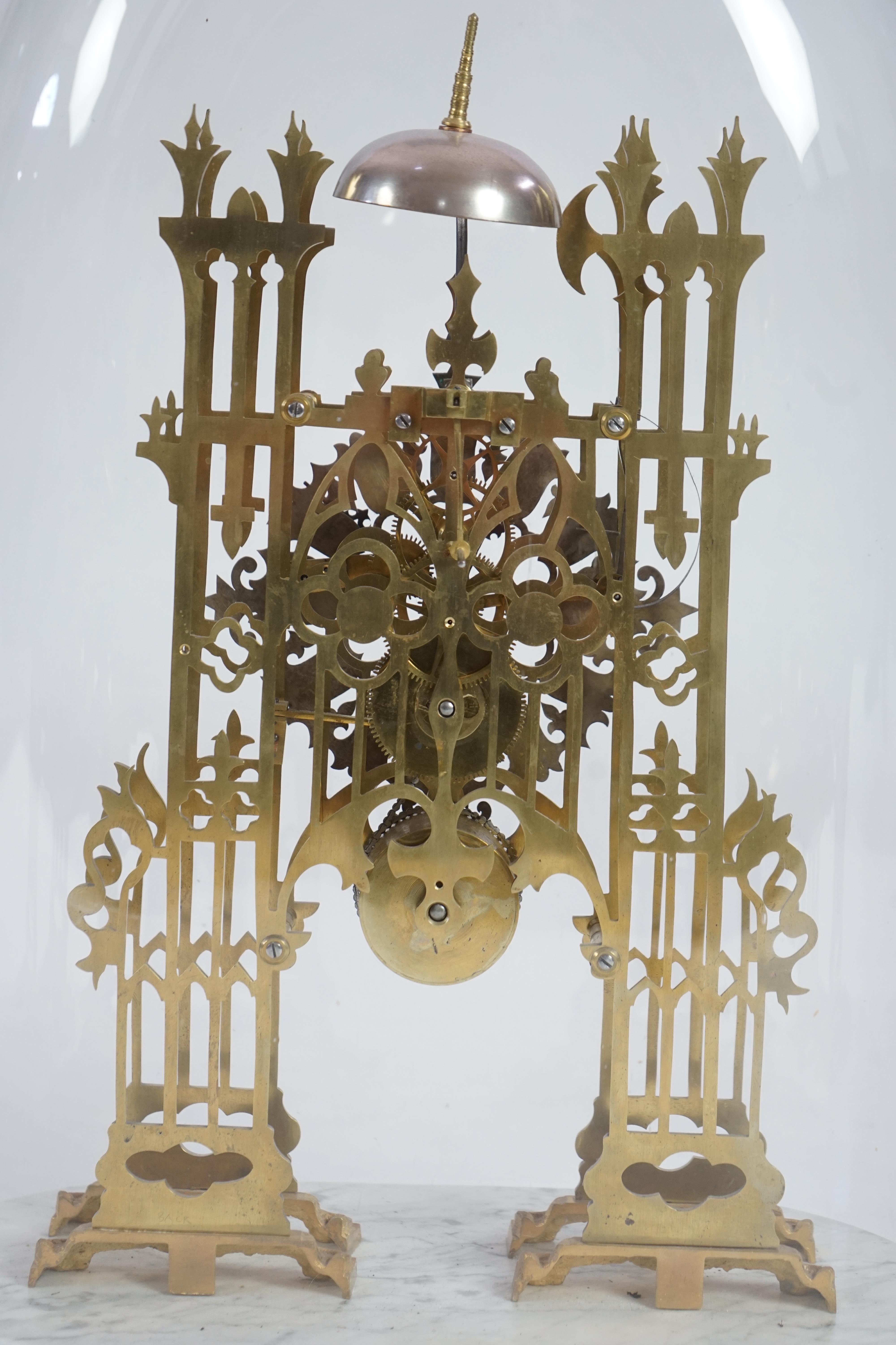 A Victorian brass cathedral front skeleton clock